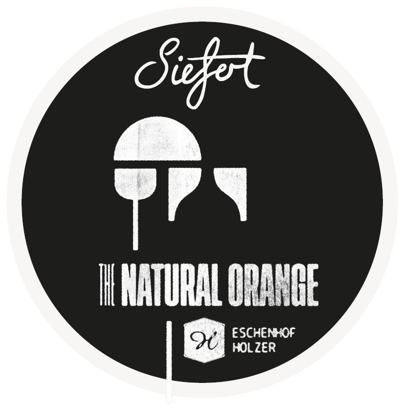 Rundt frogeye logo i sort og hvid af en orangevin